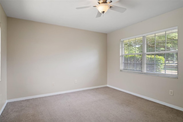 6095 W Douneray Loop, Crystal River, FL 34429 - carpeted empty room with a ceiling fan and baseboards