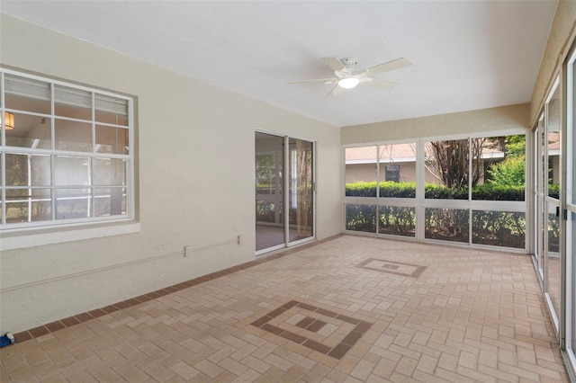 6095 W Douneray Loop, Crystal River, FL 34429 - unfurnished sunroom featuring a healthy amount of sunlight and brick floor