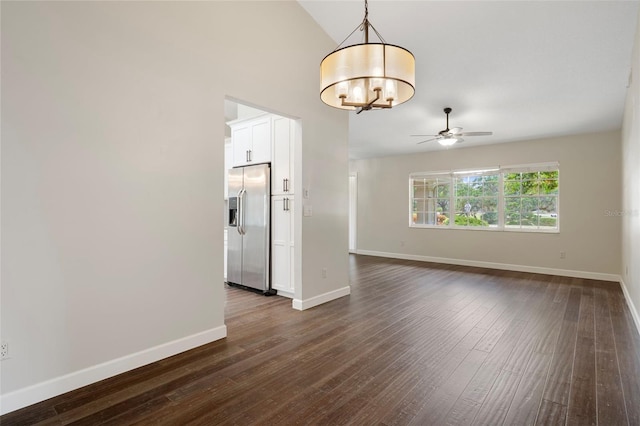 6095 W Douneray Loop, Crystal River, FL 34429 - spare room with high vaulted ceiling, baseboards, dark wood-style floors, and ceiling fan with notable chandelier