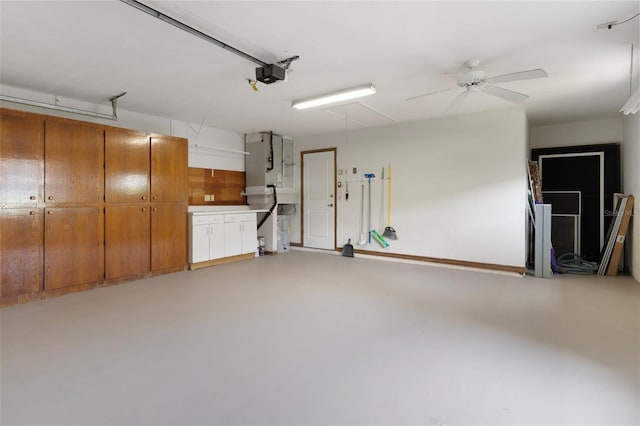 6095 W Douneray Loop, Crystal River, FL 34429 - garage with ceiling fan and a garage door opener
