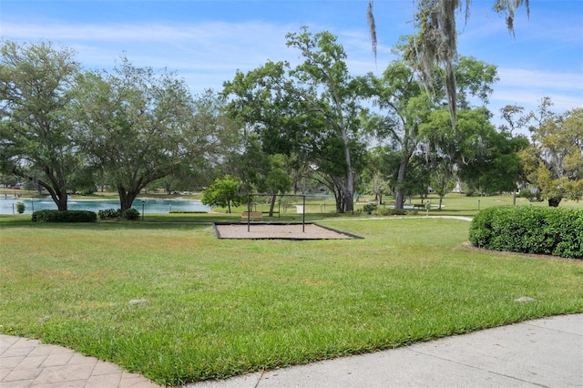 6095 W Douneray Loop, Crystal River, FL 34429 - view of property's community with a yard and a water view