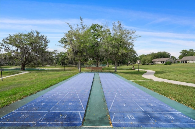 6095 W Douneray Loop, Crystal River, FL 34429 - view of home's community with a lawn and shuffleboard