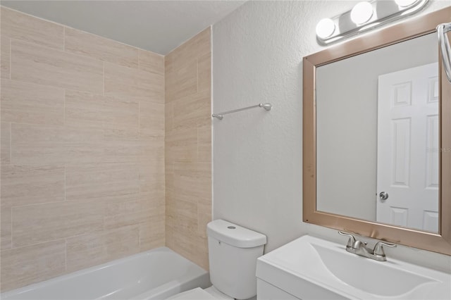 bathroom featuring toilet, vanity, and  shower combination