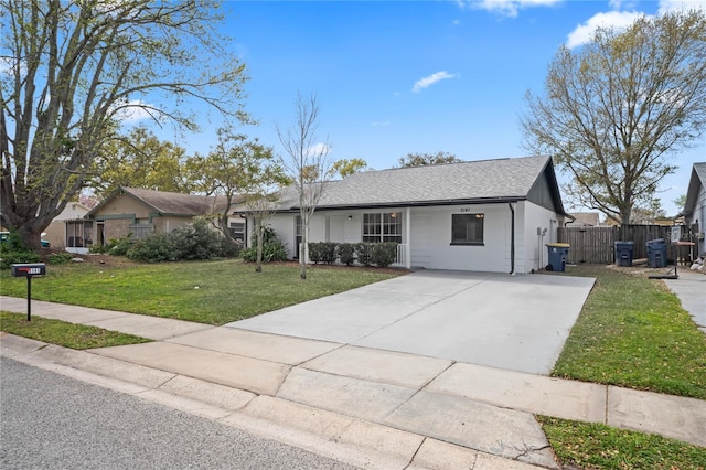 single story home featuring driveway, a front lawn, and fence