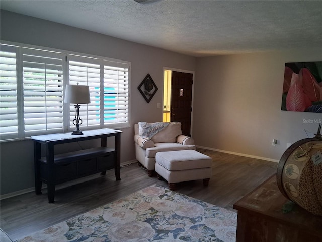 7508 Cypress Knee Dr, Hudson, FL 34667 - living room with wood finished floors, baseboards, and a textured ceiling