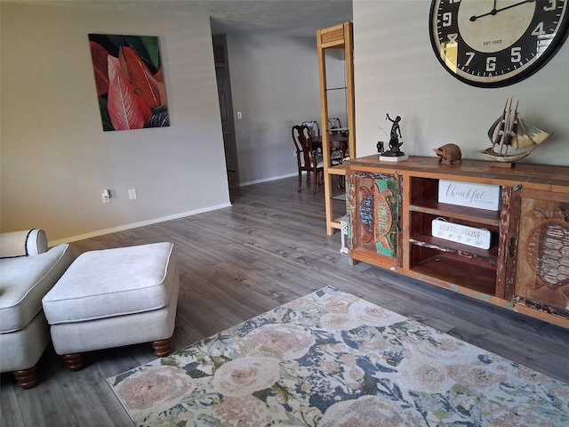 7508 Cypress Knee Dr, Hudson, FL 34667 - sitting room with baseboards and wood finished floors