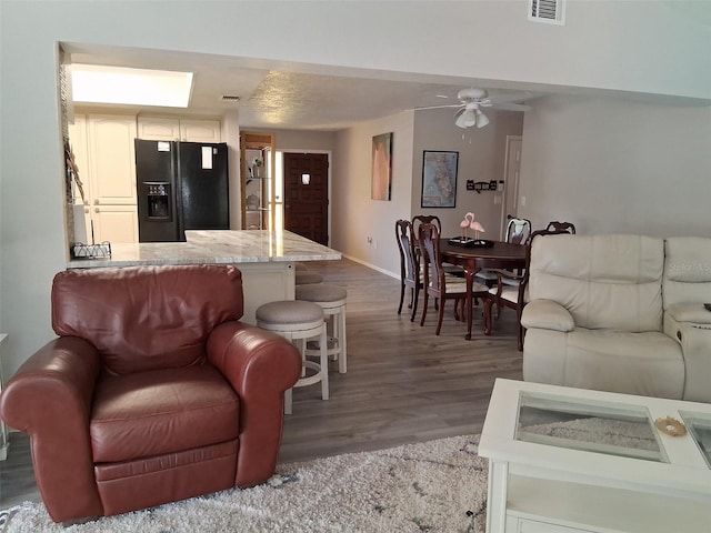 7508 Cypress Knee Dr, Hudson, FL 34667 - living area featuring wood finished floors, baseboards, and ceiling fan