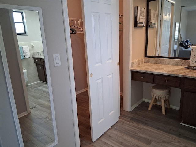 7508 Cypress Knee Dr, Hudson, FL 34667 - bathroom with wood finished floors, vanity, and baseboards