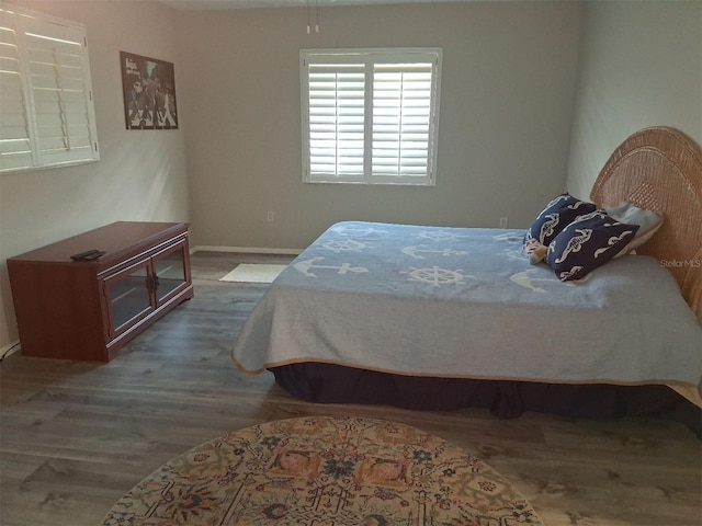 7508 Cypress Knee Dr, Hudson, FL 34667 - bedroom with wood finished floors and baseboards