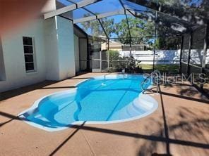7508 Cypress Knee Dr, Hudson, FL 34667 - view of pool with a patio and glass enclosure