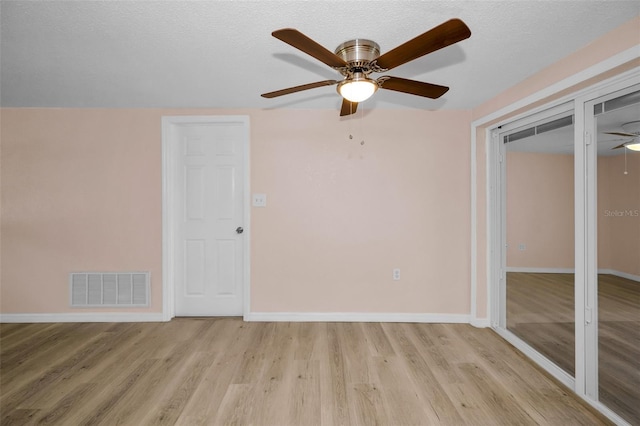 7321 Parrot Dr, Port Richey, FL 34668 - interior space with baseboards, wood finished floors, visible vents, and ceiling fan