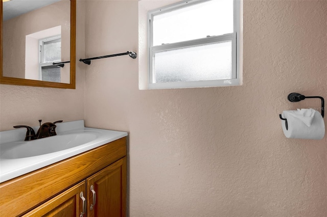 7321 Parrot Dr, Port Richey, FL 34668 - bathroom with a textured wall and vanity