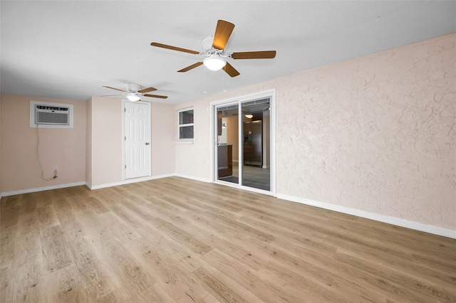 7321 Parrot Dr, Port Richey, FL 34668 - empty room with baseboards, a ceiling fan, wood finished floors, and a wall mounted air conditioner