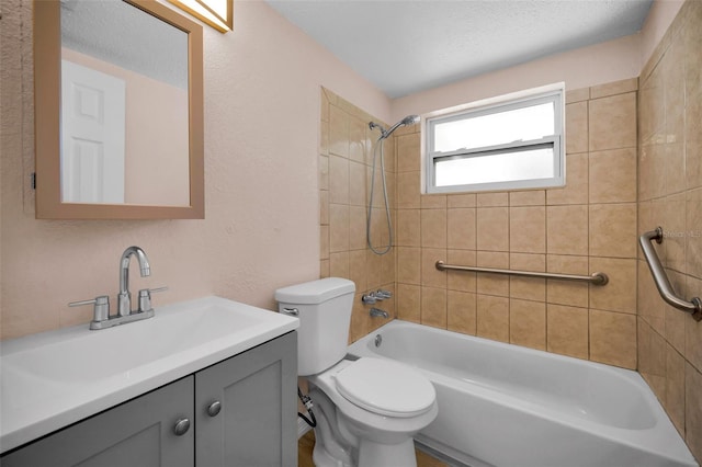 7321 Parrot Dr, Port Richey, FL 34668 - bathroom featuring toilet, a textured wall, vanity, and shower / bathing tub combination