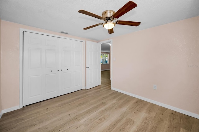 7321 Parrot Dr, Port Richey, FL 34668 - unfurnished bedroom featuring light wood-type flooring, baseboards, and visible vents