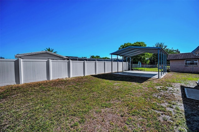 7321 Parrot Dr, Port Richey, FL 34668 - view of yard with a patio area, a detached carport, and a fenced backyard