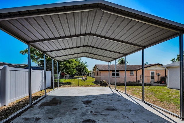 7321 Parrot Dr, Port Richey, FL 34668 - view of parking / parking lot featuring fence and a carport