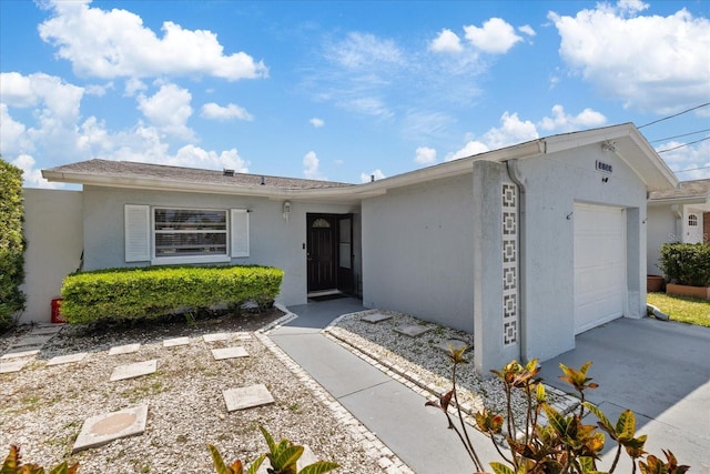 5106 Blue Heron Dr, New Port Richey, FL 34652 - single story home featuring concrete driveway, a garage, and stucco siding