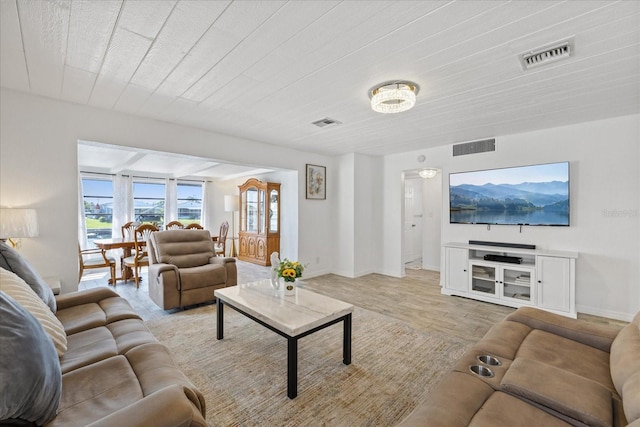 5106 Blue Heron Dr, New Port Richey, FL 34652 - living room with baseboards, visible vents, and light wood-style flooring