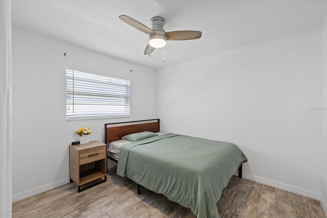 5106 Blue Heron Dr, New Port Richey, FL 34652 - bedroom featuring baseboards, wood finished floors, and ceiling fan