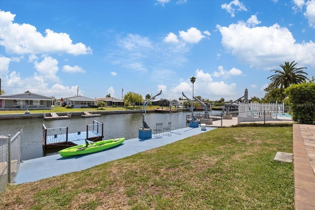 5106 Blue Heron Dr, New Port Richey, FL 34652 - dock area featuring a lawn, a water view, and fence