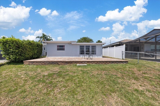 5106 Blue Heron Dr, New Port Richey, FL 34652 - back of property featuring a yard, a fenced backyard, and a patio area