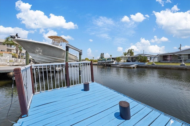 5106 Blue Heron Dr, New Port Richey, FL 34652 - view of dock with a residential view and a water view