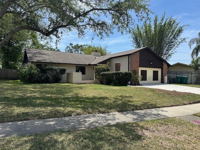 1412 Wexford Dr N, Palm Harbor, FL 34683 - ranch-style home featuring concrete driveway, fence, and a front lawn