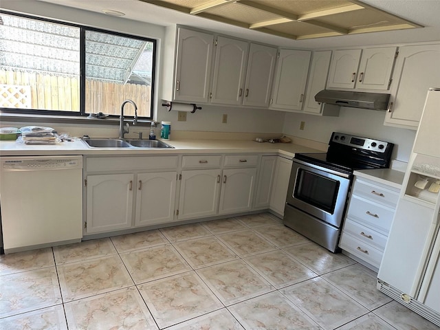 1412 Wexford Dr N, Palm Harbor, FL 34683 - kitchen with a sink, under cabinet range hood, white appliances, and light countertops