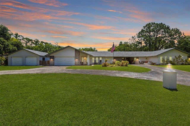 2400 Commack Ct, New Port Richey, FL 34655 - view of front facade featuring a front yard, driveway, and an attached garage
