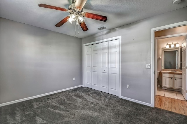 4030 Casa Del Sol Way, New Port Richey, FL 34655 - unfurnished bedroom with a closet, visible vents, carpet, and baseboards