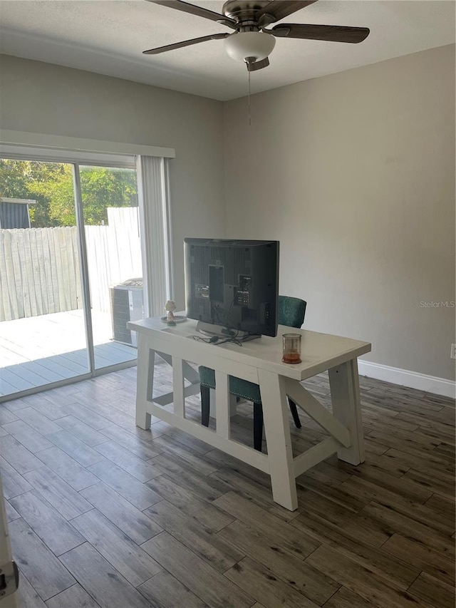 2729 Penzance St, Palm Harbor, FL 34684 - office space with a ceiling fan, baseboards, and dark wood-type flooring