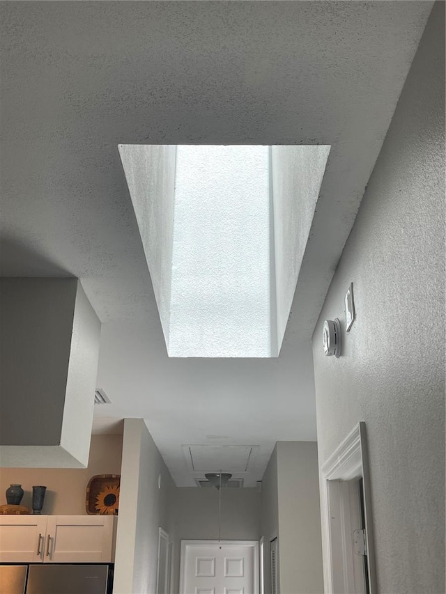 2729 Penzance St, Palm Harbor, FL 34684 - details with a textured wall and refrigerator