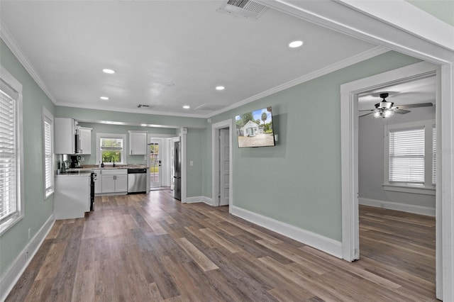 unfurnished living room featuring dark wood-style floors, baseboards, visible vents, and recessed lighting