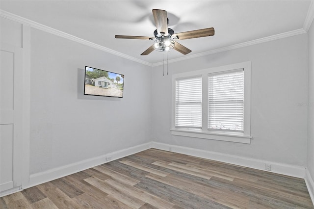unfurnished room with a ceiling fan, wood finished floors, and crown molding