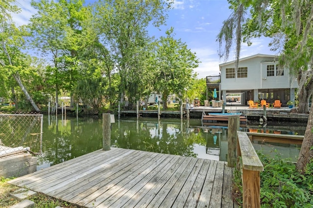 dock area with a water view
