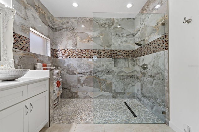 bathroom featuring a walk in shower, vanity, recessed lighting, and tile patterned flooring