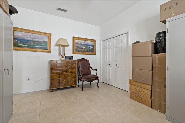 living area featuring light tile patterned floors
