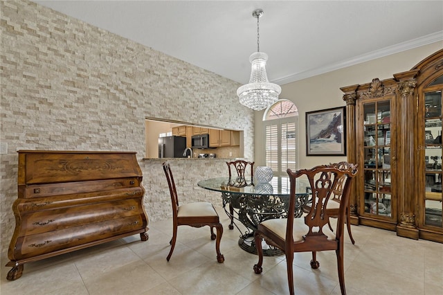 dining area with a chandelier and light tile patterned flooring
