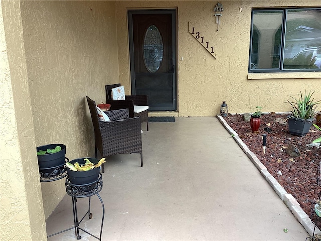 13111 Sheridan Dr, Hudson, FL 34667 - entrance to property with stucco siding