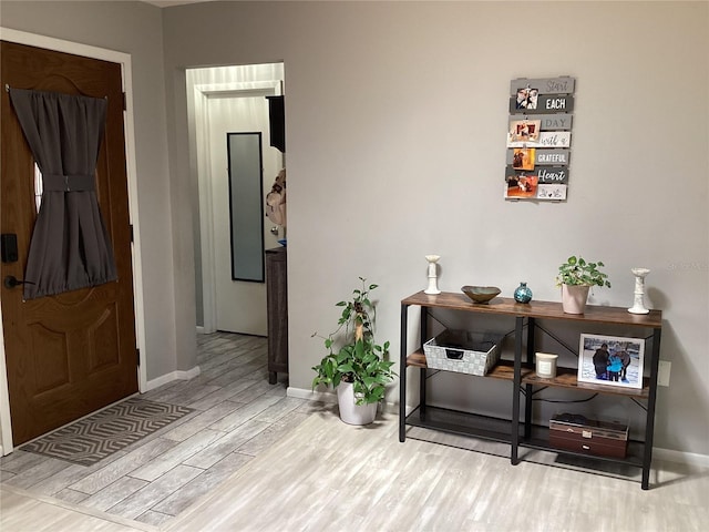 13111 Sheridan Dr, Hudson, FL 34667 - entrance foyer with wood finished floors and baseboards