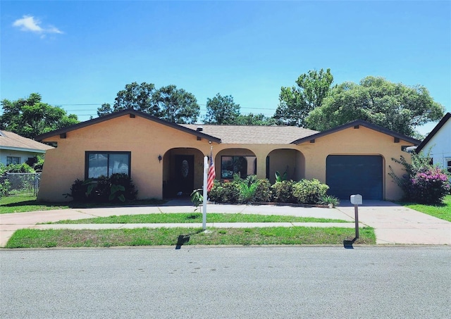 13111 Sheridan Dr, Hudson, FL 34667 - ranch-style home with stucco siding, a garage, and driveway