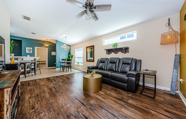 8604 Corinthian Way, New Port Richey, FL 34654 - living area featuring lofted ceiling, wood finished floors, baseboards, a ceiling fan, and a chandelier