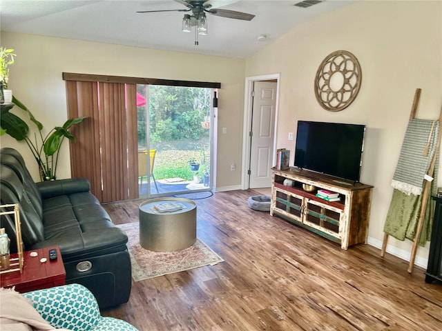8604 Corinthian Way, New Port Richey, FL 34654 - living area with lofted ceiling, wood finished floors, a ceiling fan, and baseboards