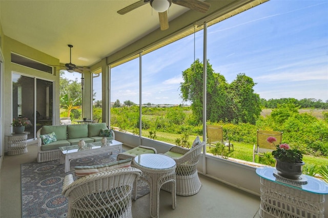 sunroom featuring an outdoor hangout area and ceiling fan