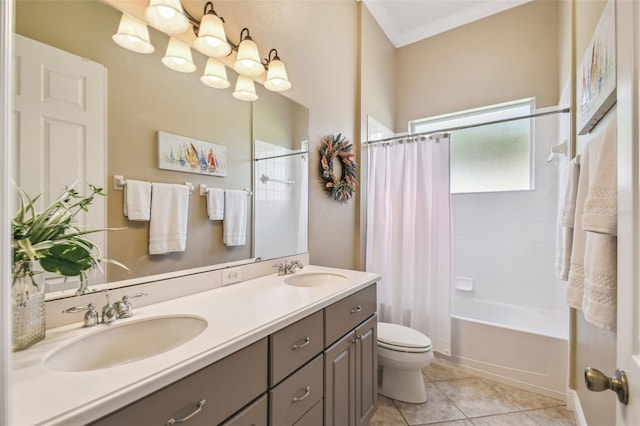bathroom featuring a sink, shower / bath combo, toilet, and double vanity