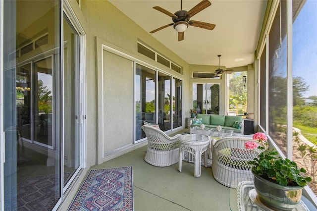 sunroom with french doors, a ceiling fan, and outdoor lounge area