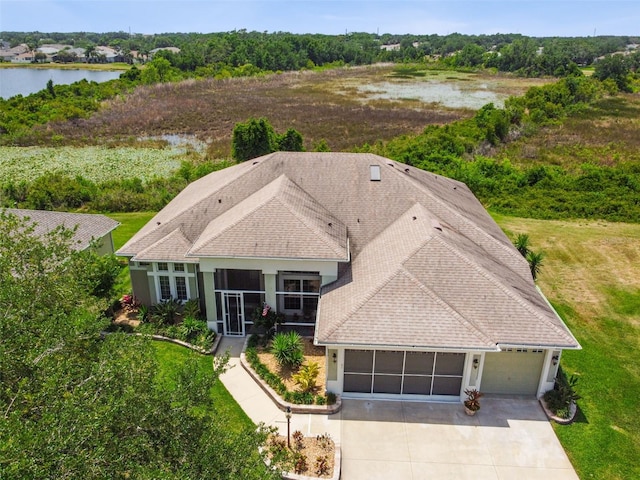 birds eye view of property with a water view