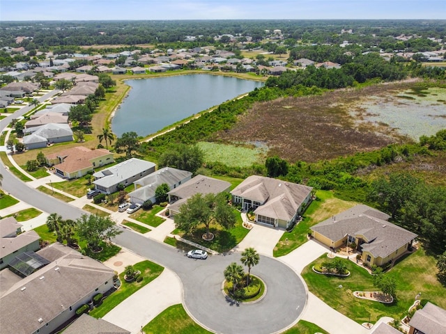 drone / aerial view featuring a water view and a residential view