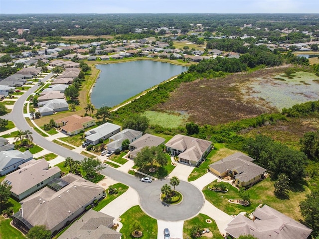 drone / aerial view with a residential view and a water view